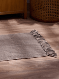 Small Beige And Black Rug